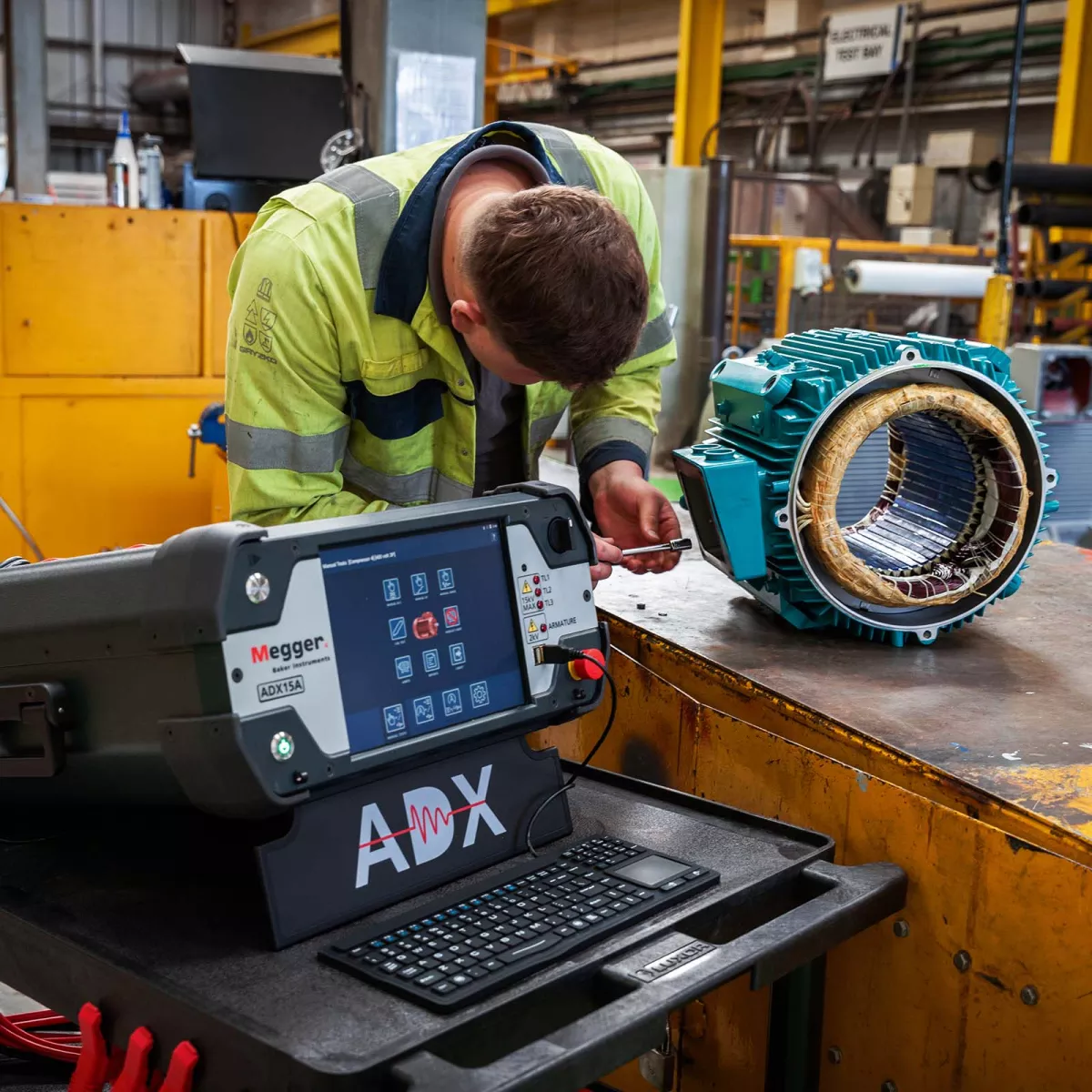 Electric motor being tested and repaired on work bench